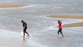 Locals collecting shellfish along the beach